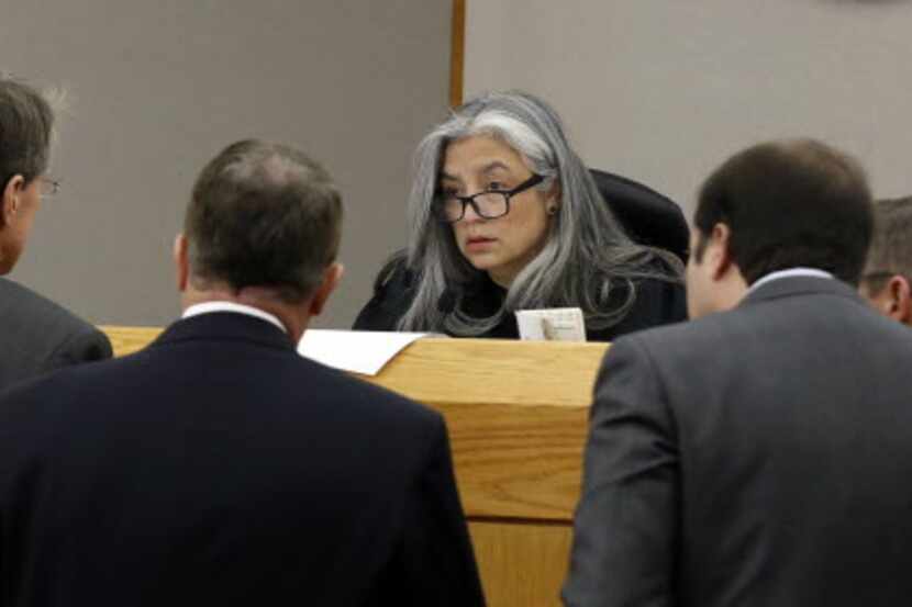 Then-state District Judge Lena Levario of the 204th Criminal District Court listened to...