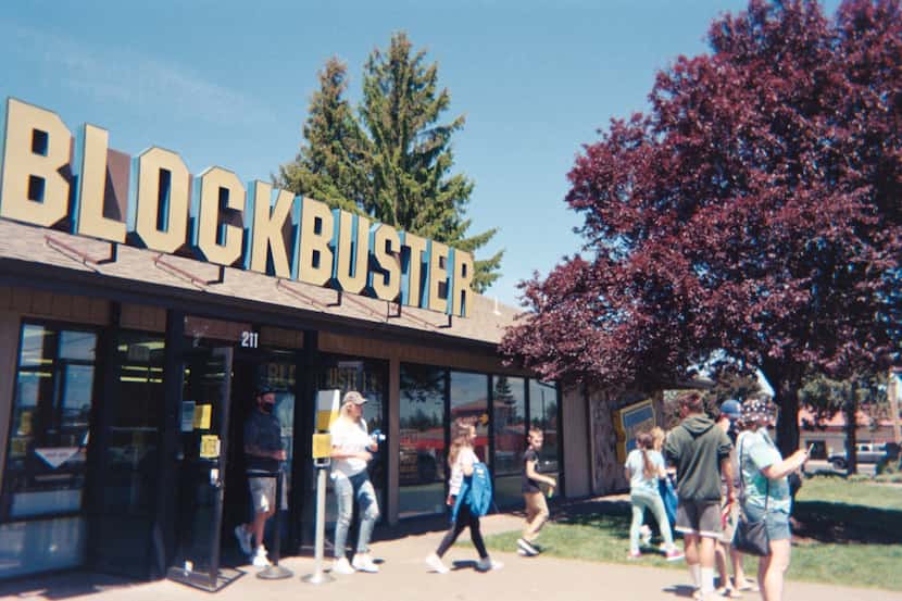 Visitors mill around outside the last Blockbuster store in Bend, Ore., on May 31, 2021.
