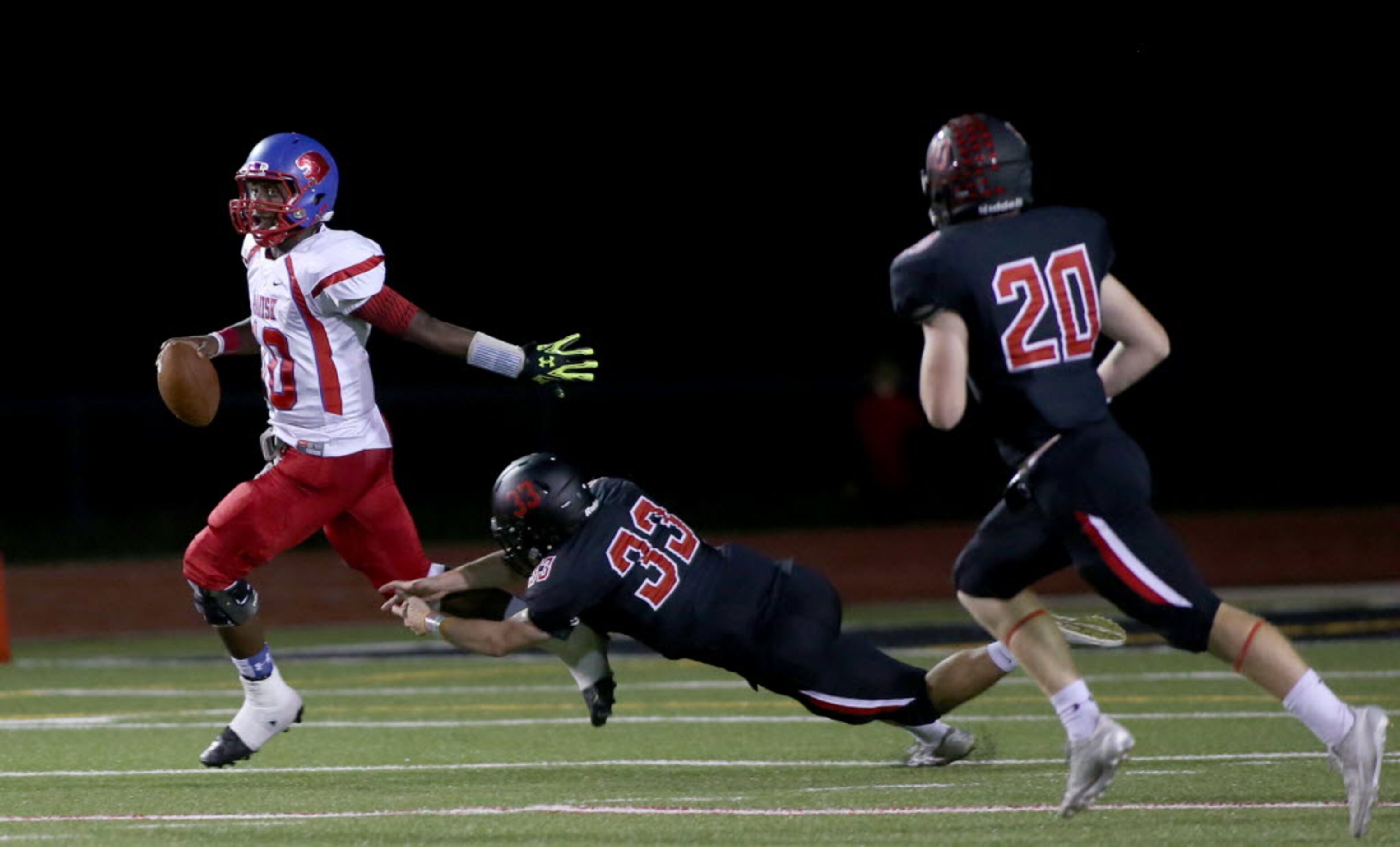 Parish Episcopal’s Jeremy Hodge (10) is pressured by Fort Worth Christian’s Christian Neal...