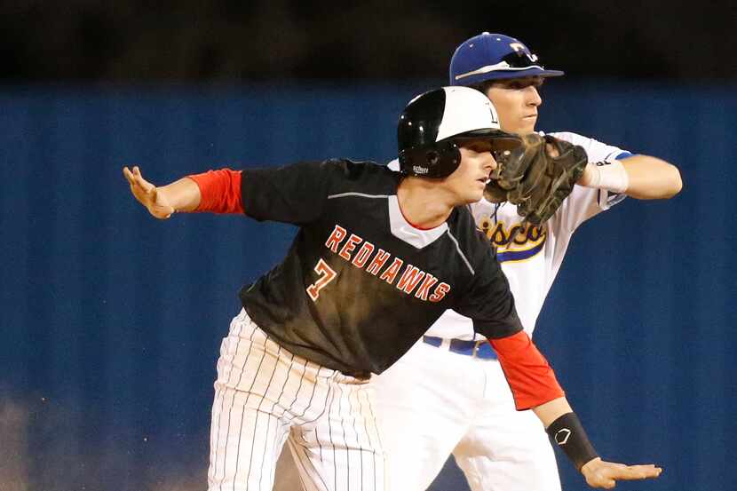 Frisco Liberty's Justin Crider (7) steals second safely as Frisco's Jake Stacy looks for the...