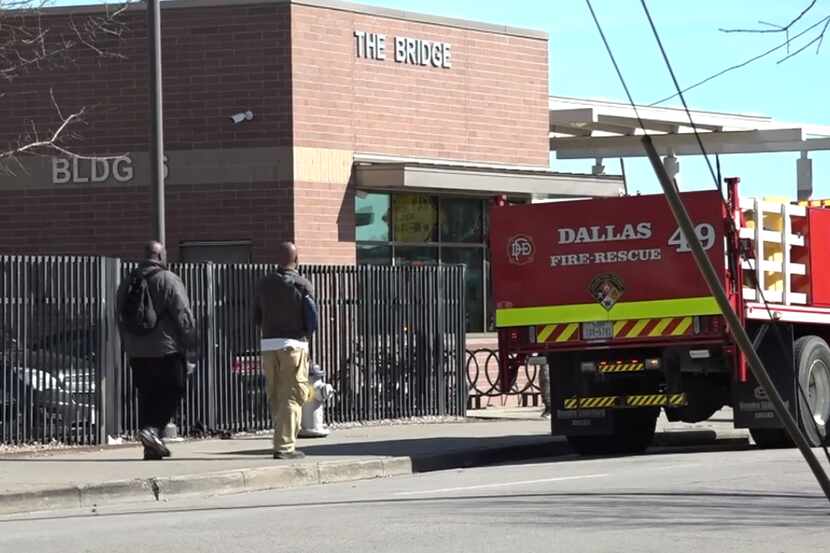 A Dallas Fire-Rescue truck at The Bridge homeless center in downtown Dallas. Sixteen people...