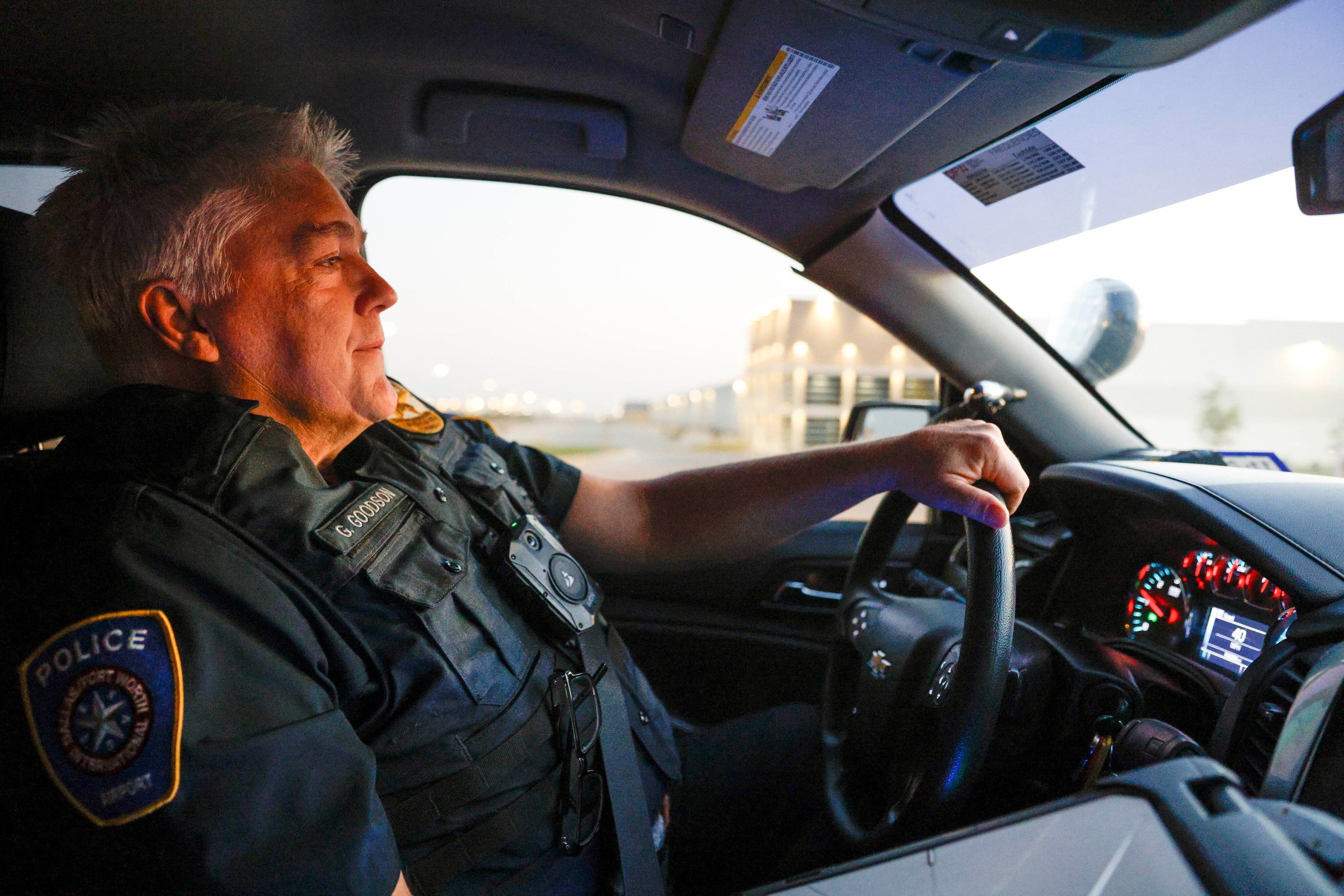 DFW Airport police officer Gary Goodson patrols a warehouse district at DFW International...