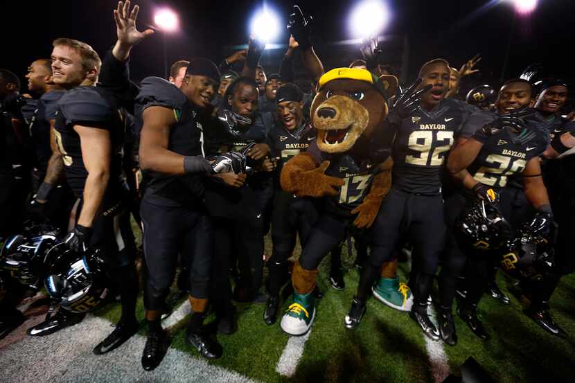 Baylor players celebrate after beating Oklahoma, 41-12, at Floyd Casey Stadium in Waco.