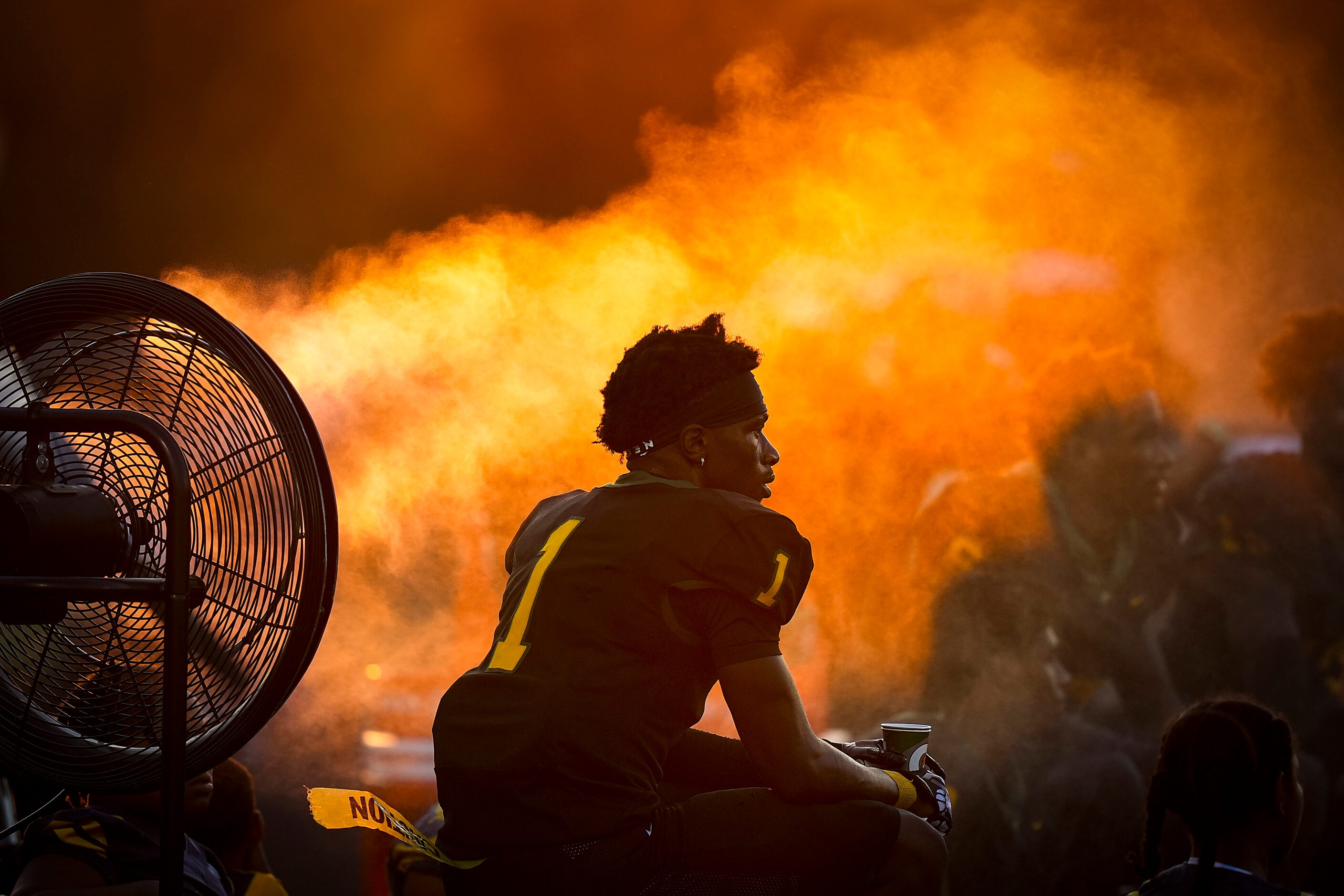 DeSoto wide receiver Johntay Cook II cools off on the sidelines during the first half of a...