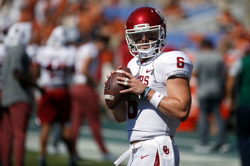 Oklahoma quarterback Baker Mayfield (6) warms up before playing Texas in an NCAA college...