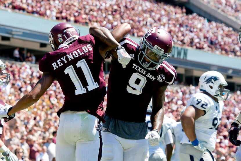 Texas A&M's Josh Reynolds (11) celebrates a first quarter touchdown with teammate Ricky...