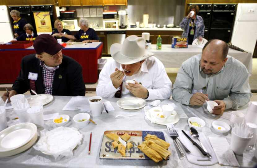 Judges (from left) Billy Hines, Frank Wood and Mike Rogers taste tamales during the Great...