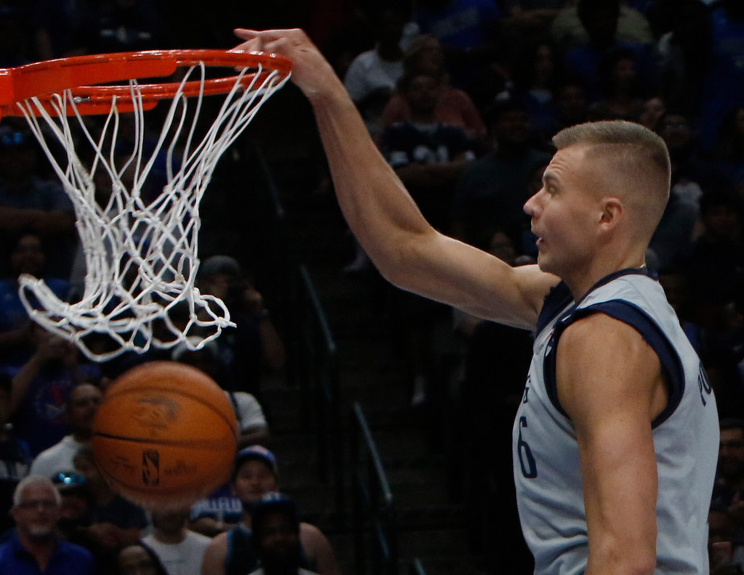 Dallas Mavericks center Kristaps Porzingis (6) makes the net dance as he dunks during...