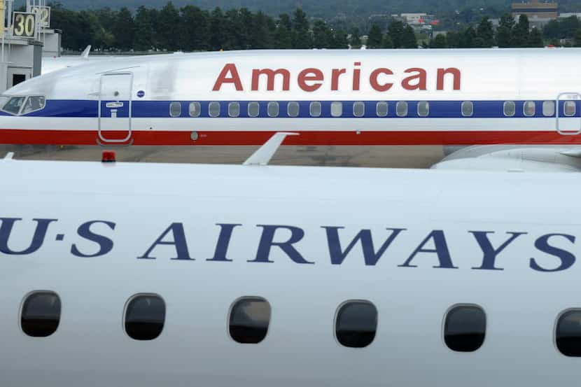 American and US Airways’ combined passenger traffic rose 5.7 percent in December from a year...
