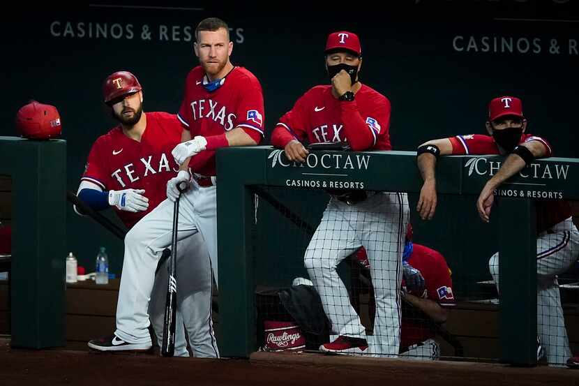 From left, Texas Rangers outfielder Joey Gallo, third baseman Todd Frazier, bench coach Don...
