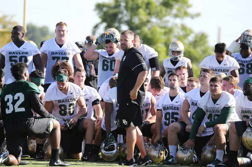 FILE - In this July 27, 2017, file photo, Baylor head football coach Matt Rhule, center,...