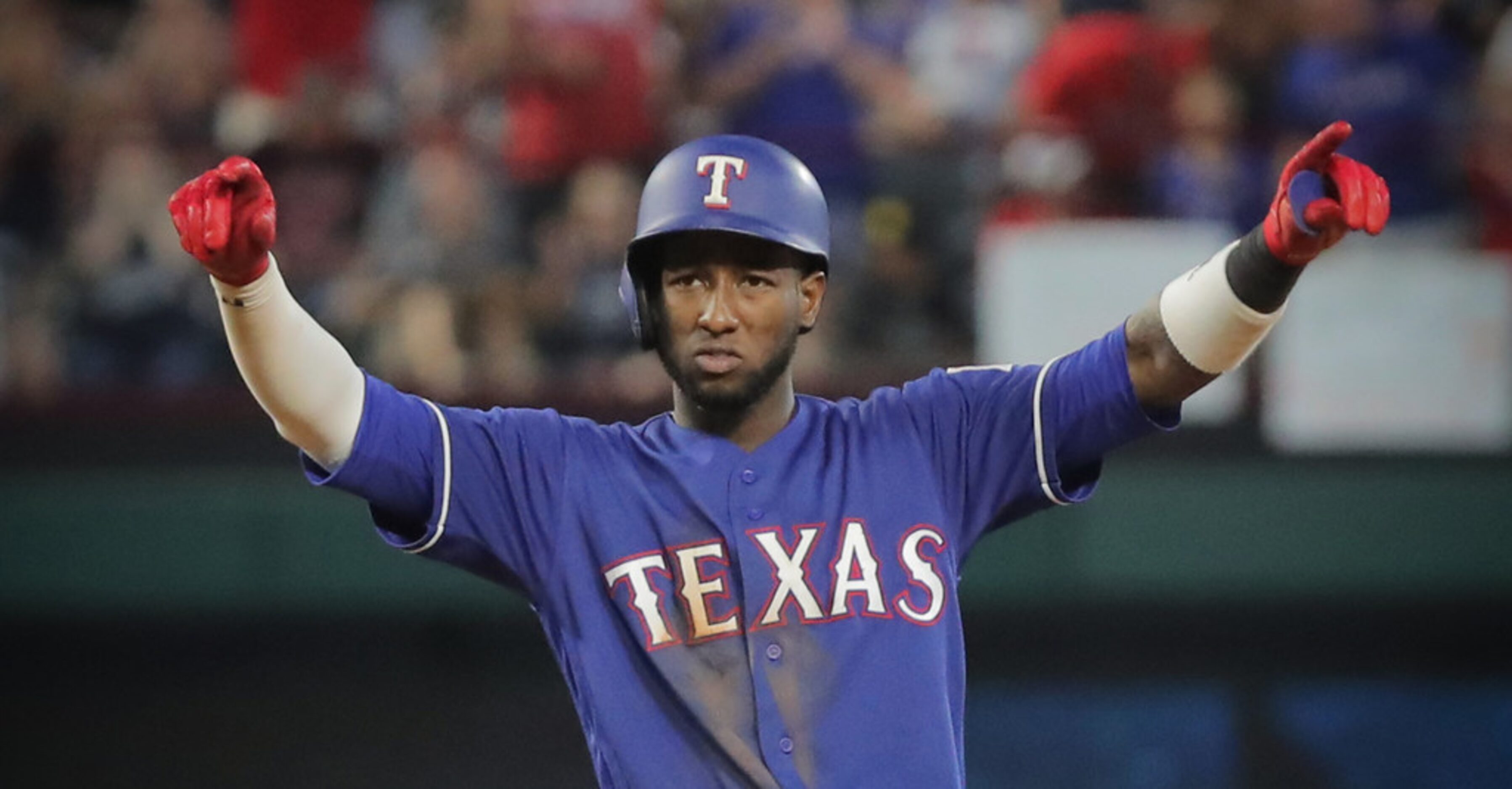 Texas Rangers shortstop Jurickson Profar (19) celebrates hitting a three-run double in the...