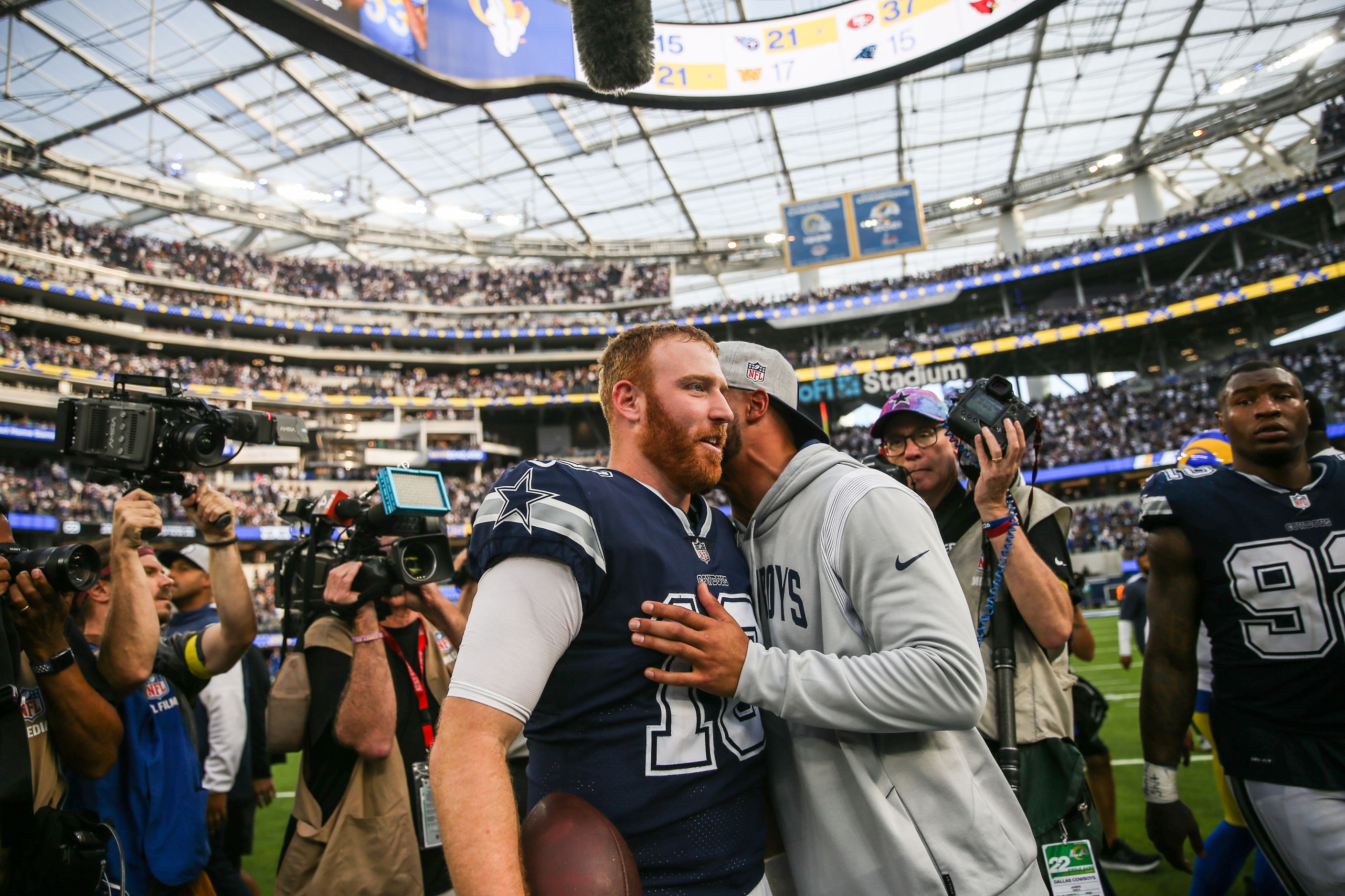 Dallas Cowboys quarterback Dak Prescott (4) congratulates quarterback Cooper Rush (10) after...