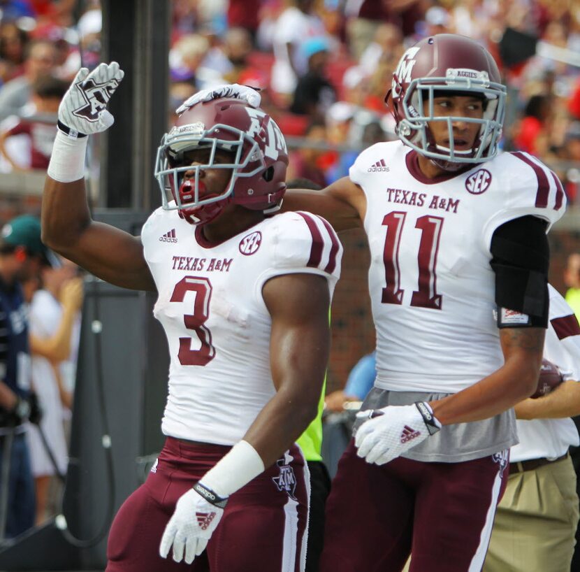 FILE - Texas A&M running back Trey Williams (3) scores a touchdown in the first quarter to...