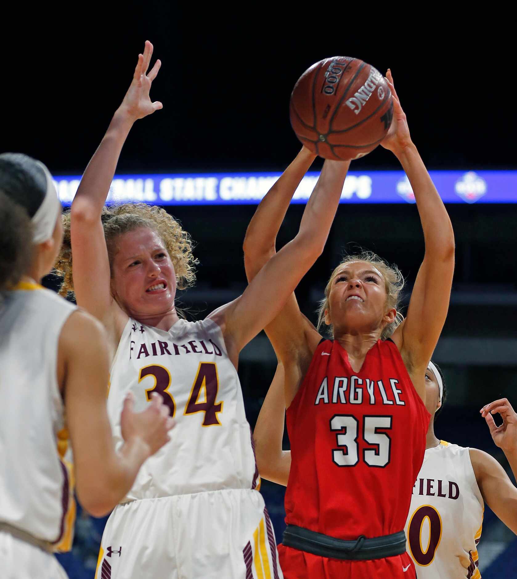 Argyle forward Shelby Henches #35 battles Fairfield center Braden Bossier #34 for a rebound...