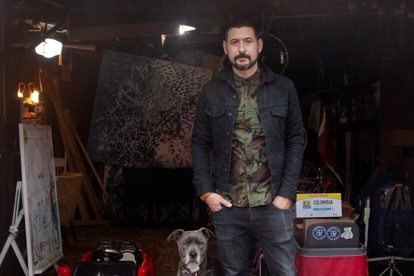 Artist Nic Mathis with his dog, Max, photographed in his studio in Dallas on Jan. 22, 2019.