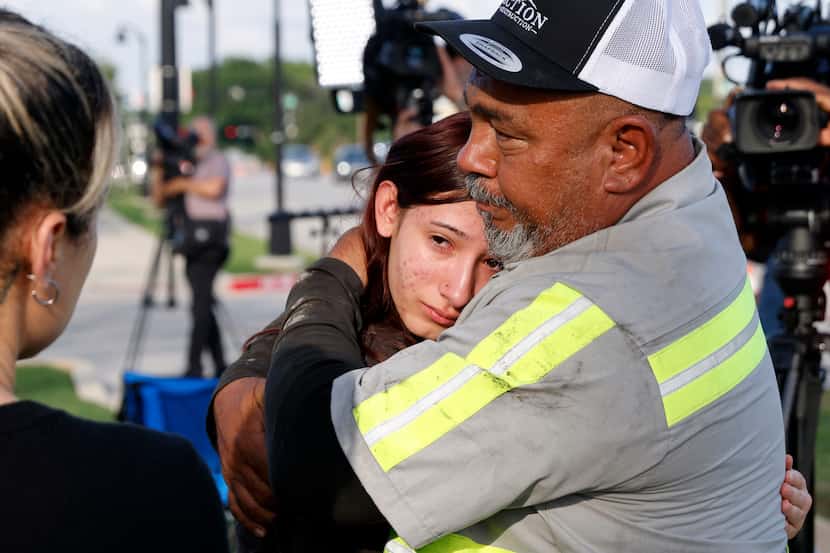 David Barrera hugs his eldest granddaughter Amiah Barrera, 15, after being reunited at...