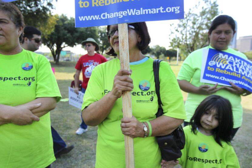 Maria Valdez (center) was one of the speakers at the OUR WalMart rally, which included a...