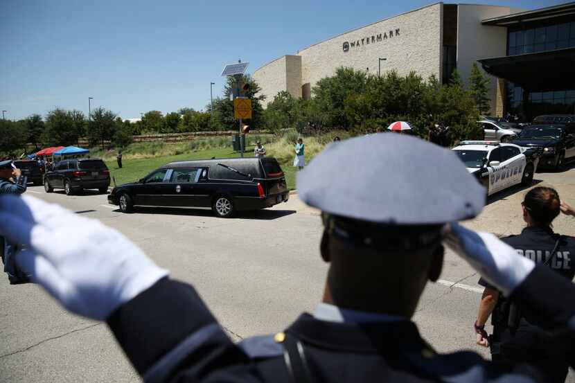 The hearse carrying Dallas police sergeant Michael Smith  leaves after the funeral for Smith...