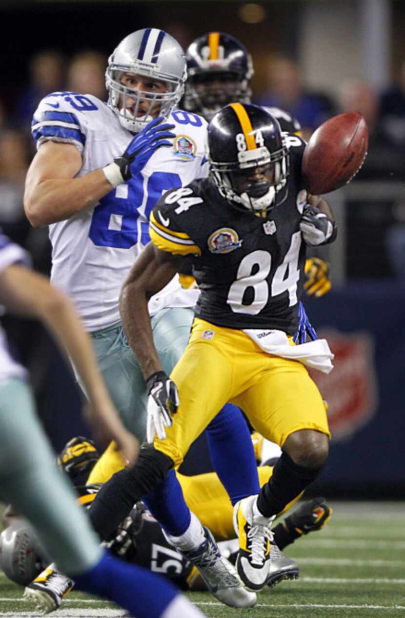Pittsburgh Steelers punt returner Antonio Brown (84) has the ball knocked from his hand by...