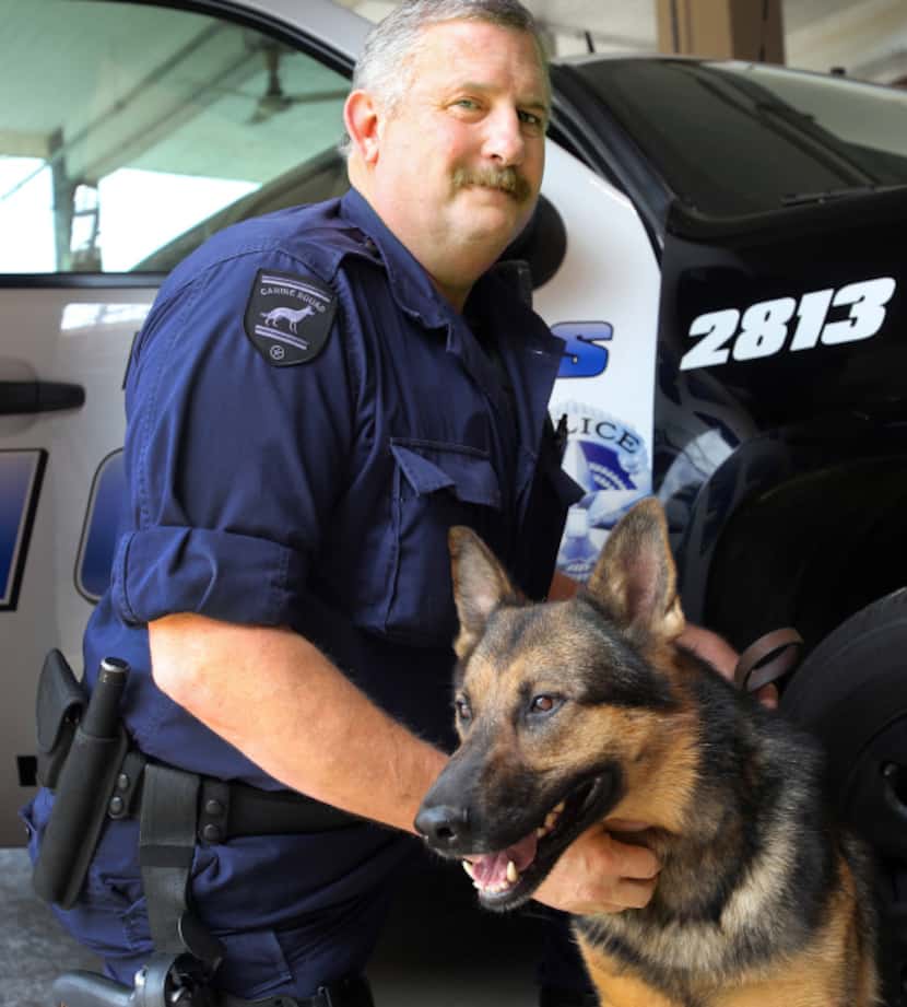 Craig Woods, then a senior corporal, with his police dog El in 2013