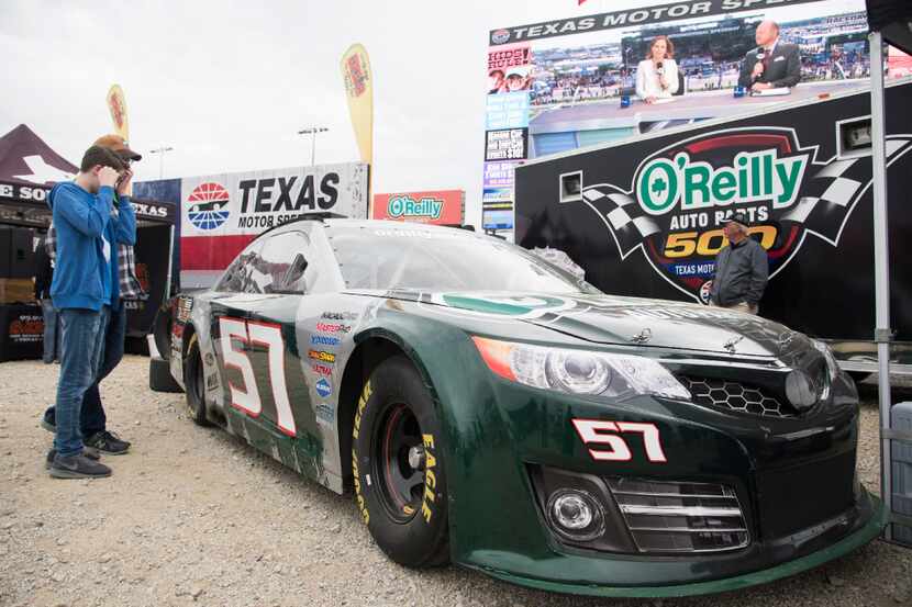 FORT WORTH, TX - FEBRUARY 26:  Fans check out the O'Reilly Auto Parts car before watching...