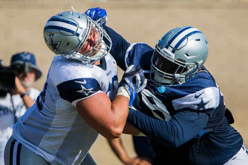 Dallas Cowboys defensive tackle Trysten Hill (79, right) takes on offensive guard Connor...