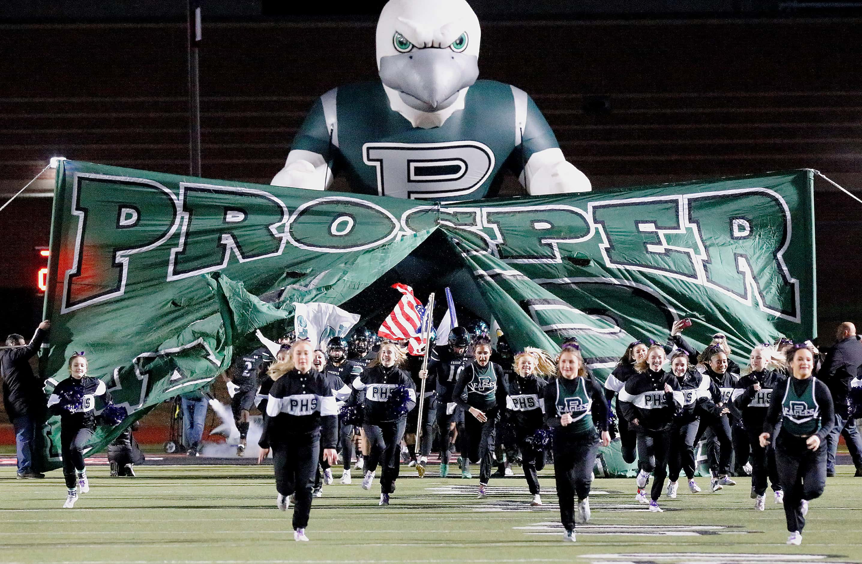 Prosper High School takes the field before kickoff as Grand Prairie High School played...