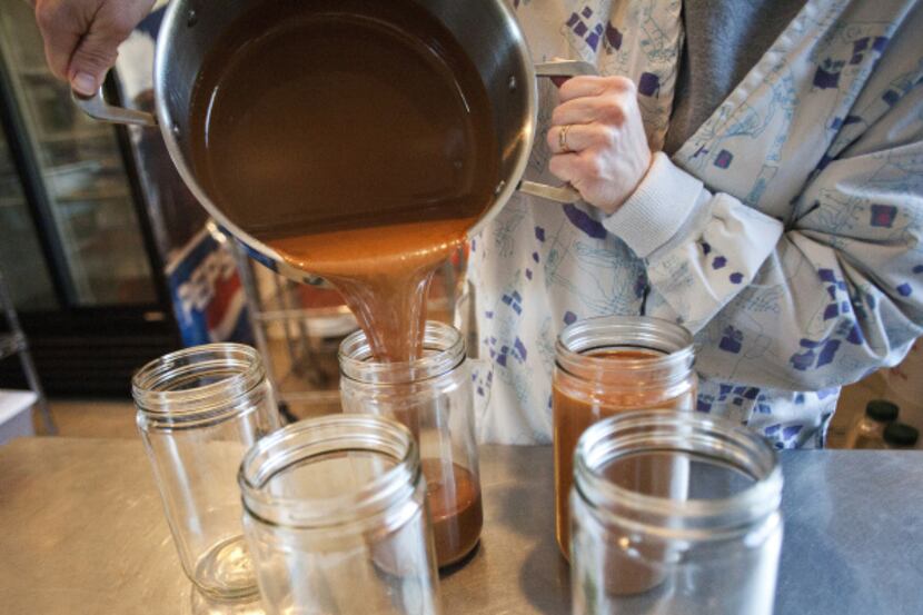 Karen Tippit pours a batch of cajeta. She can have six pots going at a time, and says the...
