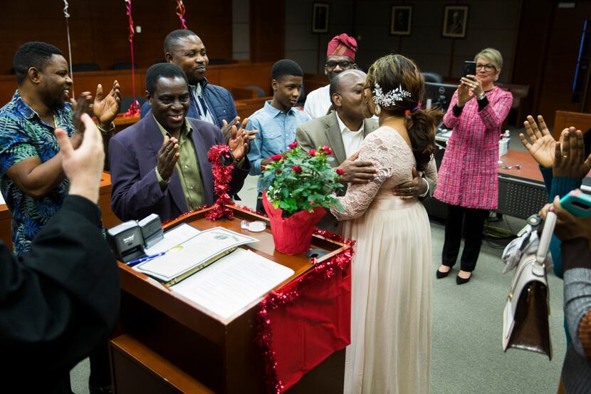 Bin Mazola and Titilope Oluyemi kissed as their families applauded after they were married...