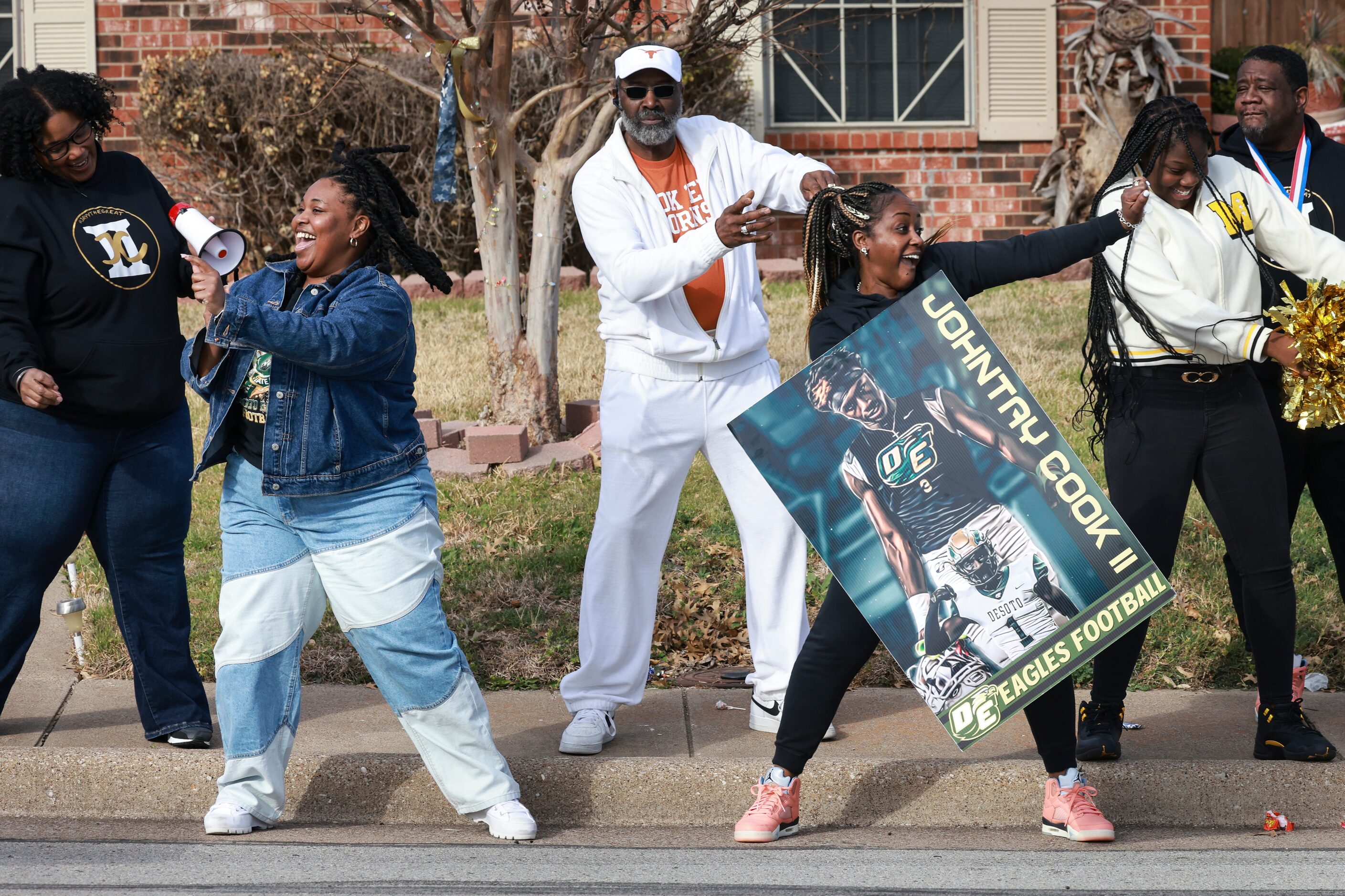 Courtney Porter and Tracie Cook (front) dance during the parade, Saturday, Jan. 21, 2023, in...