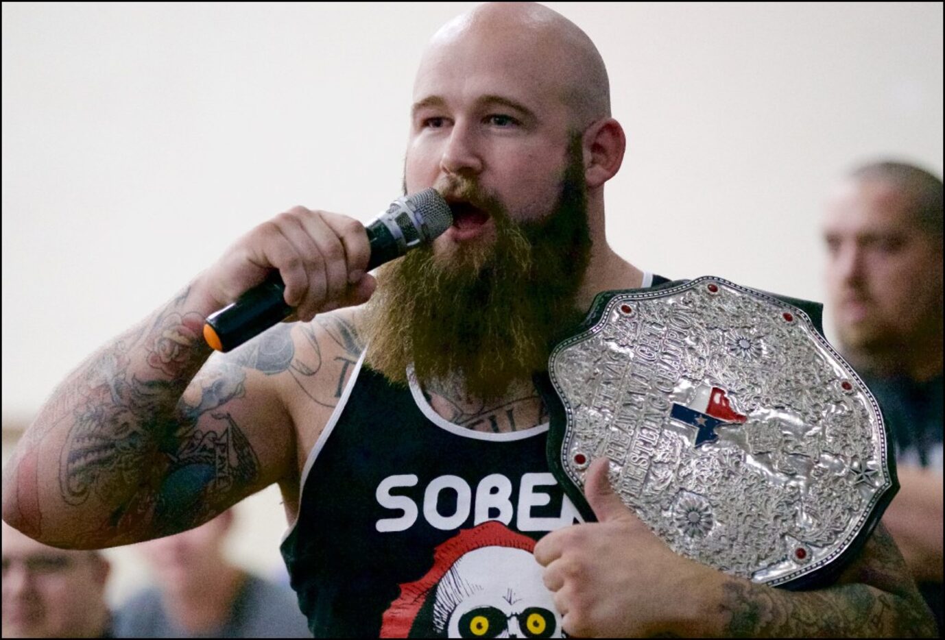 Professional wrestler Ray Rowe rallies spectators during a VIP Wrestling match in Arlington,...