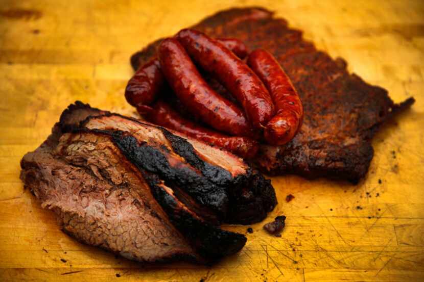 A selection of brisket, sausage and ribs from Franklin Barbecue in Austin, Saturday,...