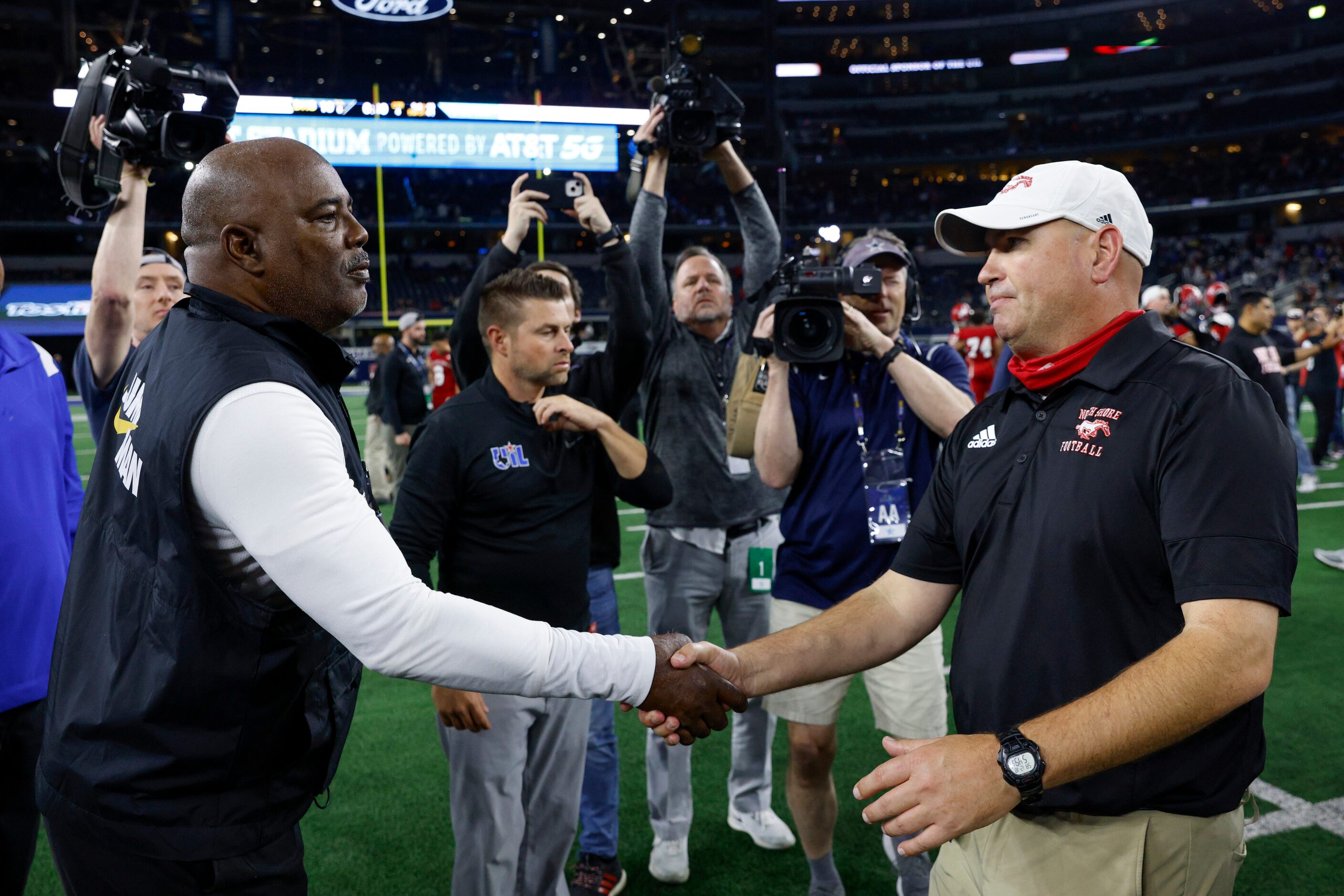 Duncanville head coach Reginald Samples greets Galena Park North Shore head coach Jon Kay...