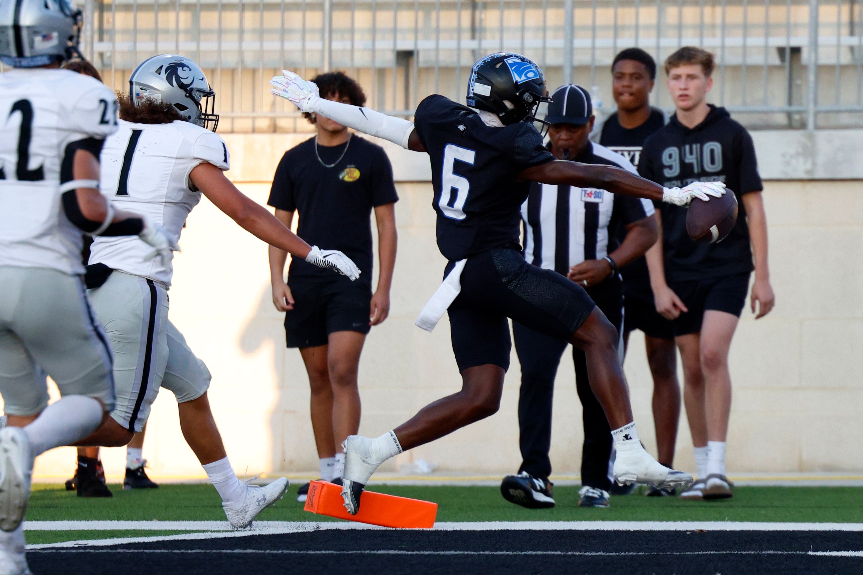 North Crowley wide receiver Quentin Gibson (6) stretches the ball across the goal line ahead...