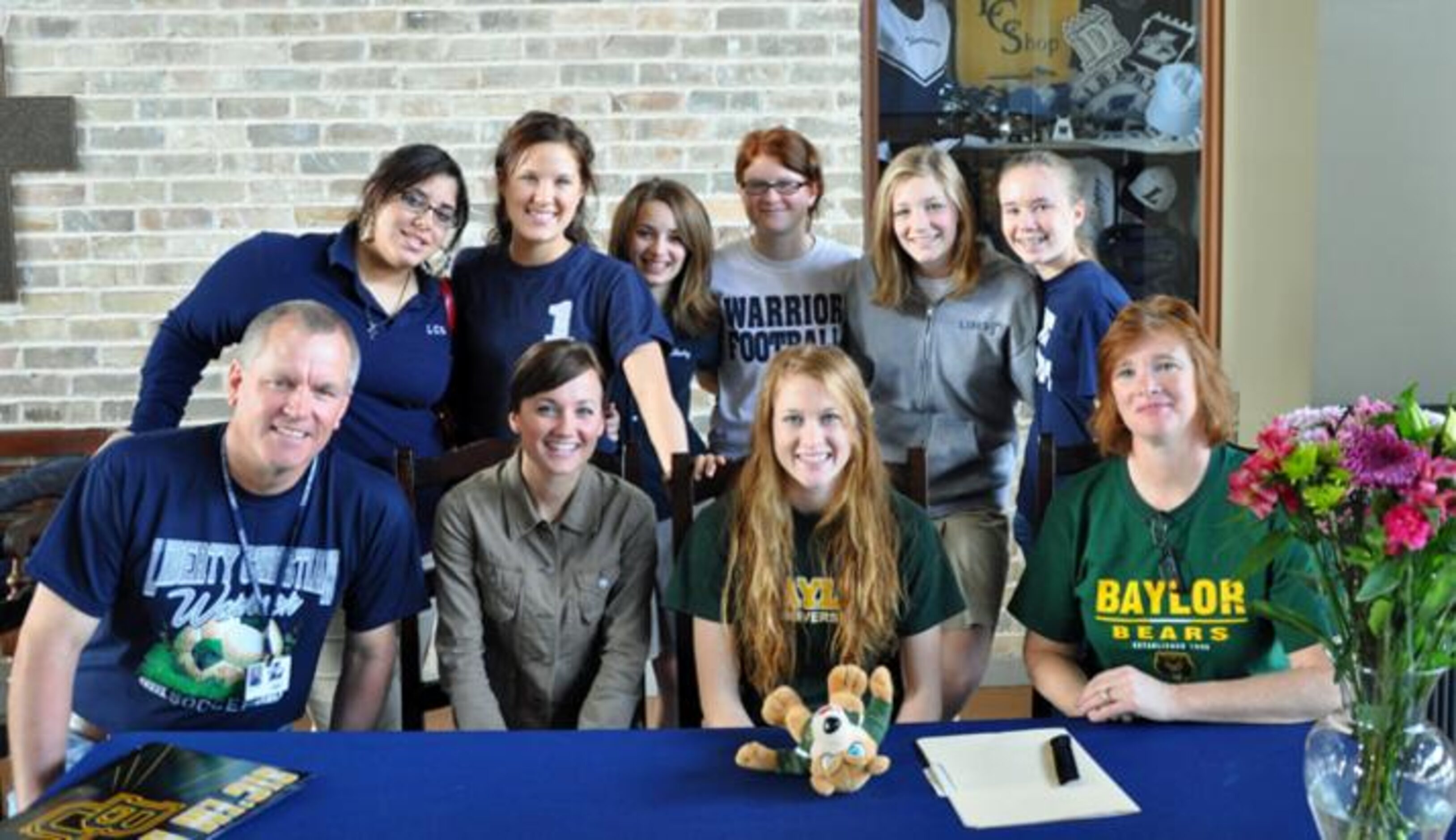 Argyle Liberty Christian senior Kaitlyn Berry (front row, third from left) is joined by...