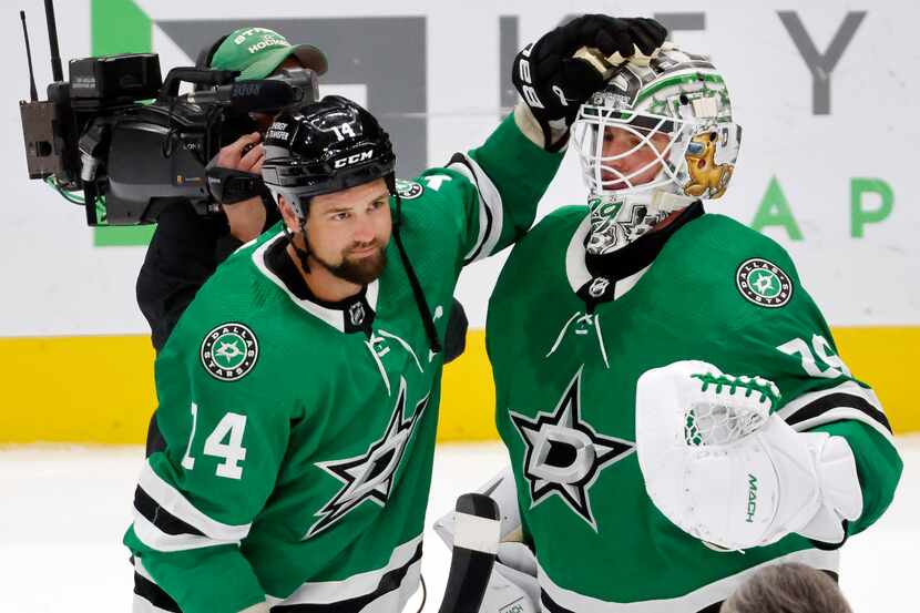 Dallas Stars left wing Jamie Benn (14) congratulates goaltender Jake Oettinger (29) after...