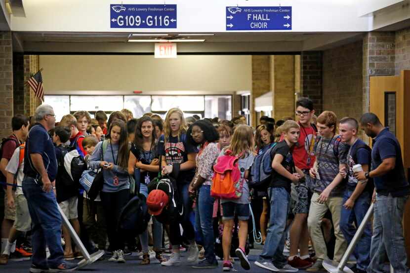 A look at the crowded conditions in the main hallway at the Lowery Freshman Center in Allen,...