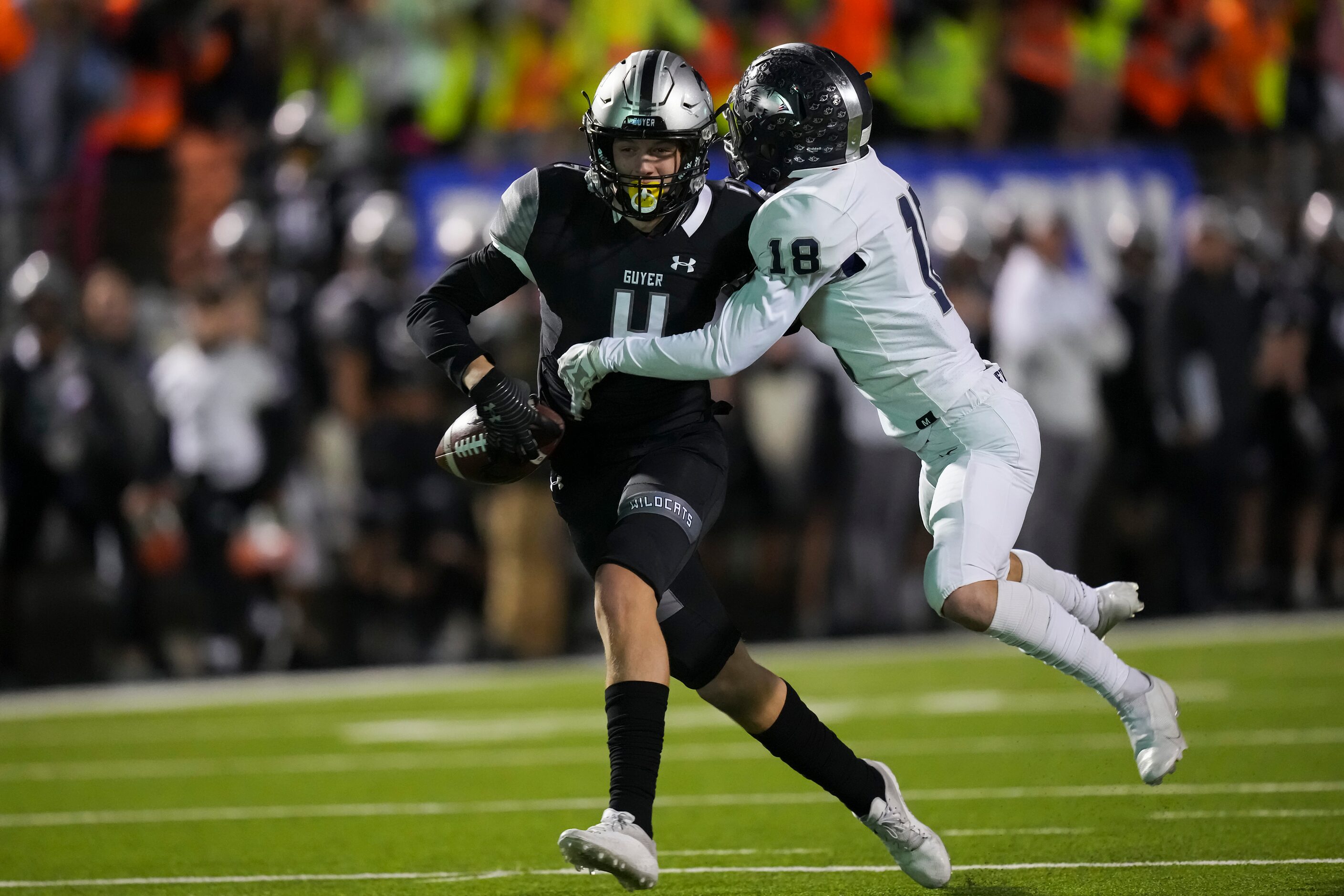 Denton Guyer wide receiver Brody Noble (4) fumbles as he is hit by Flower Mound cornerback...