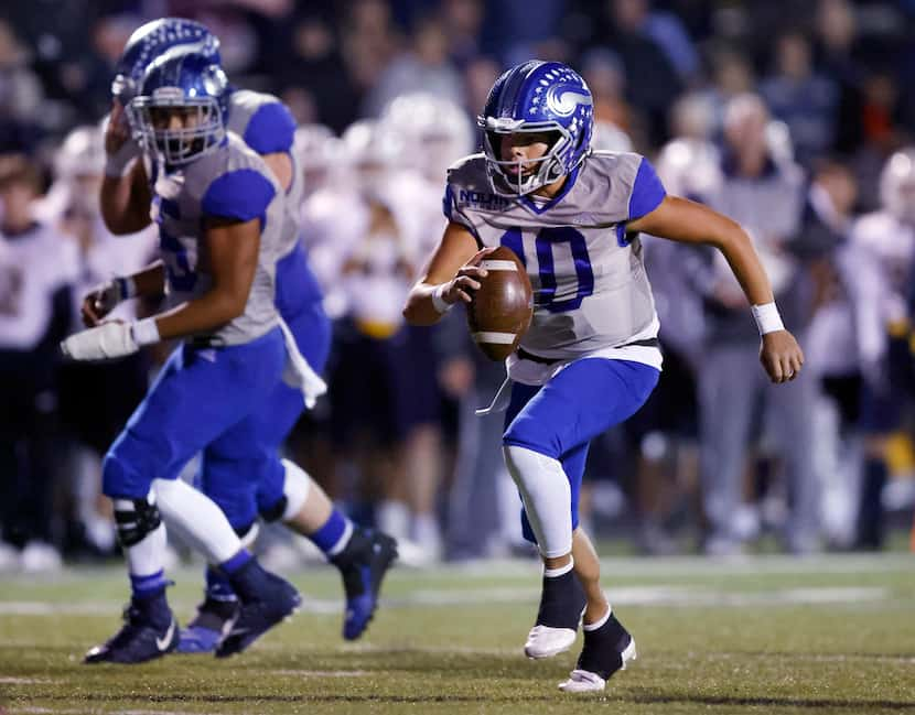 Fort Worth Nolan quarterback Cole Matsuda (10) keeps the ball and runs for a first-quarter...