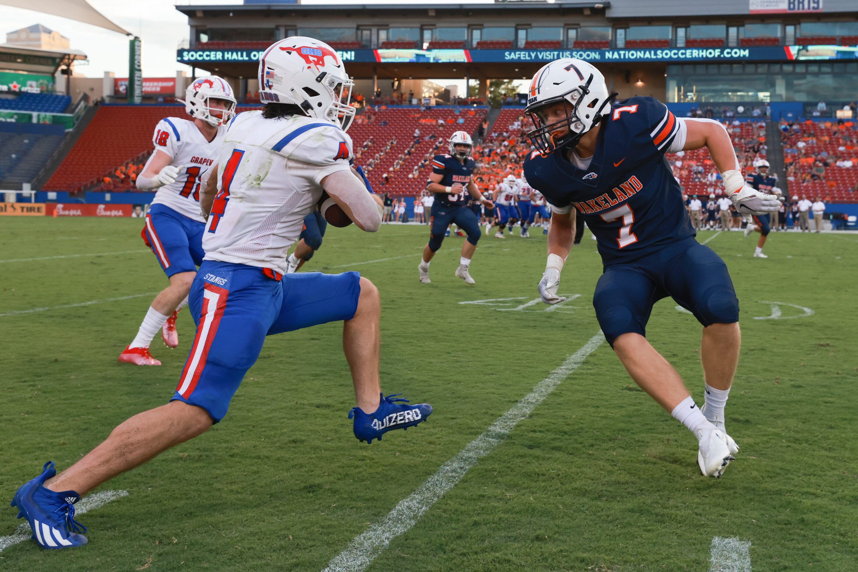 Grapevine High School’s Parker Polk avoids a tackle by Wakeland High School’s Ty Gleason...