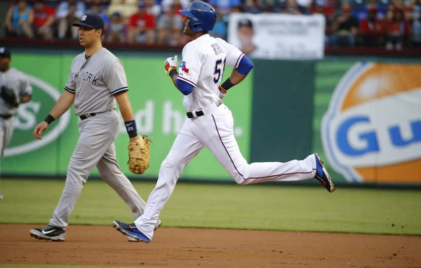 Texas Rangers right fielder Alex Rios (51) rounds the bases against the New York Yankees...