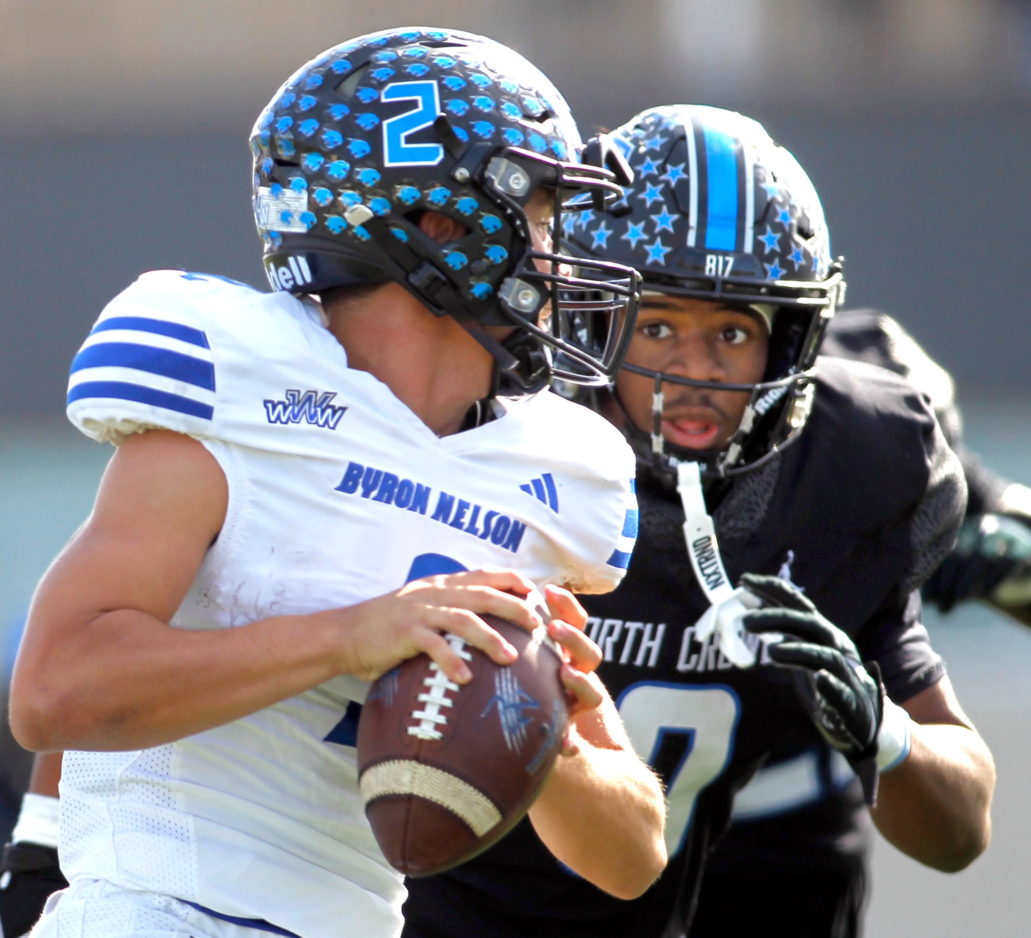 Byron Nelson quarterback Grant Bizjack (2), left, feels the defensive pressure from  North...