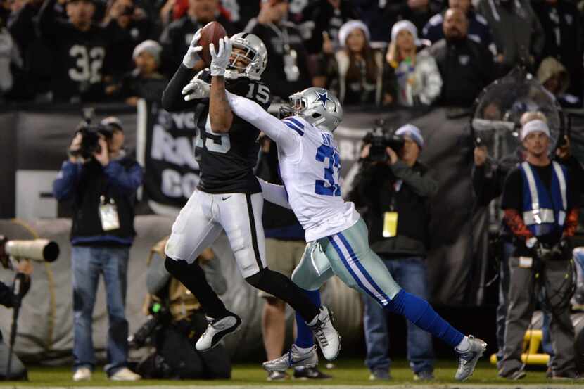 FILE - Michael Crabtree #15 of the Oakland Raiders catches a pass for a touchdown against...