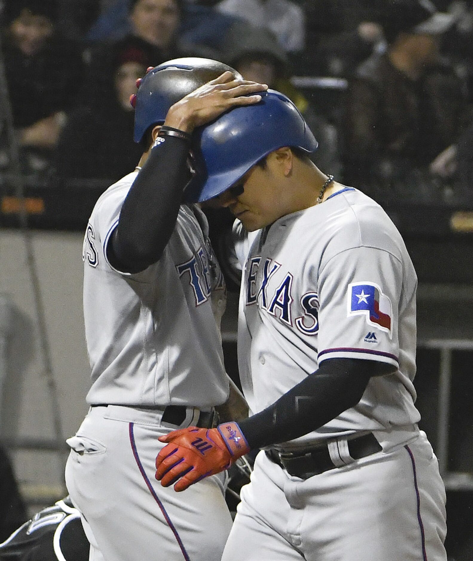 CHICAGO, IL - MAY 18: Shin-Soo Choo (R) of the Texas Rangers is greeted by Delino DeShields...