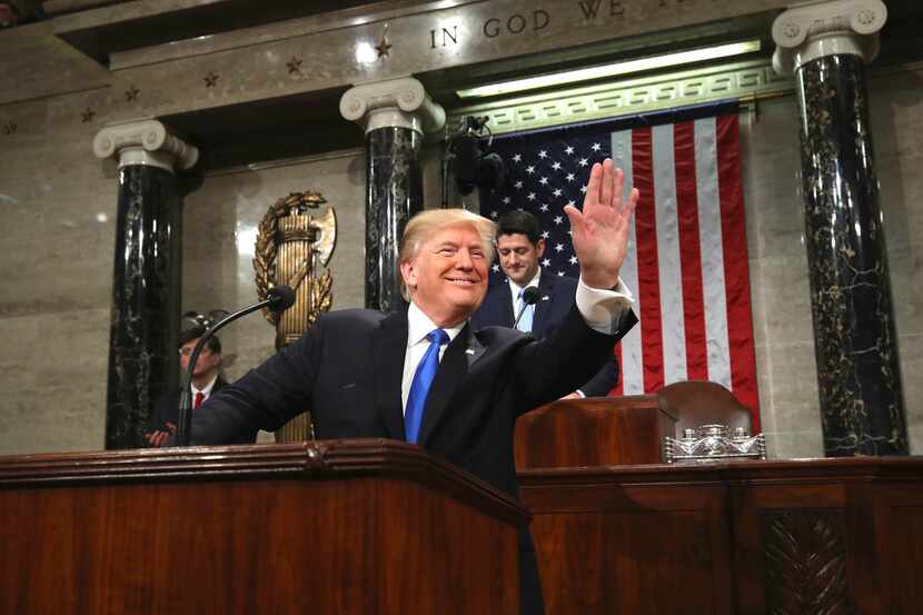 President Donald Trump arrives to deliver his first State of the Union Address to a joint...
