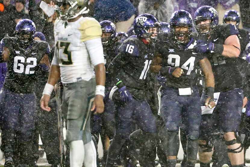  November 27, 2015--TCU Horned Frogs defensive end Josh Carraway (94) celebrates with...