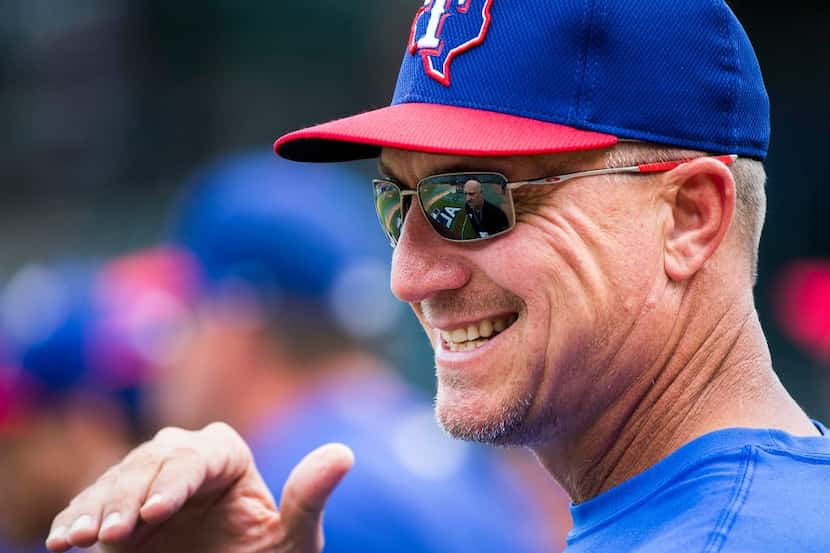 Texas Rangers manager Jeff Banister talks to reporters during the team workout at Globe Life...