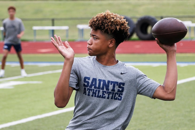 Fort Worth All Saints freshman quarterback TJ Williams looks to throw a pass during a 7 on 7...