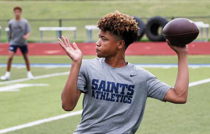 Fort Worth All Saints freshman quarterback TJ Williams looks to throw a pass during a 7 on 7...